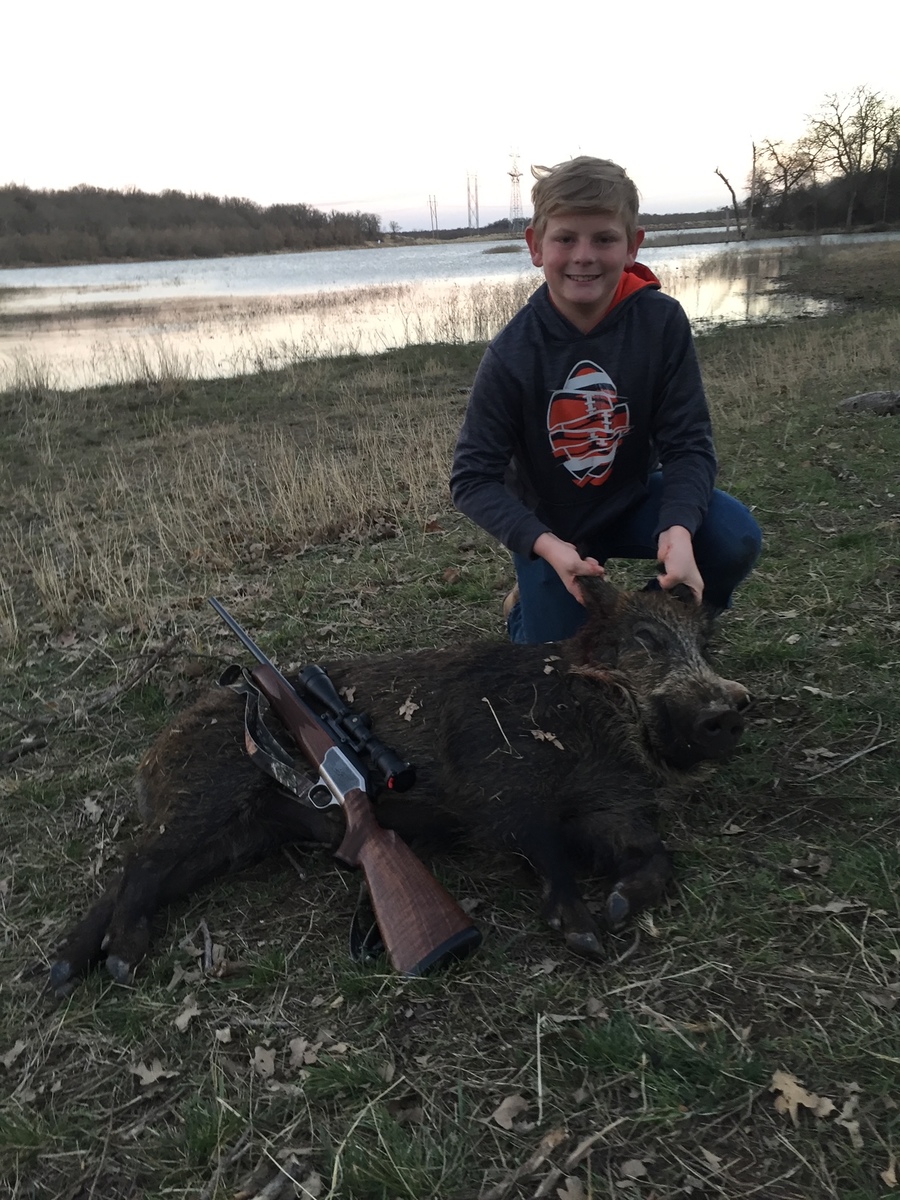 Ethan with first hog 0